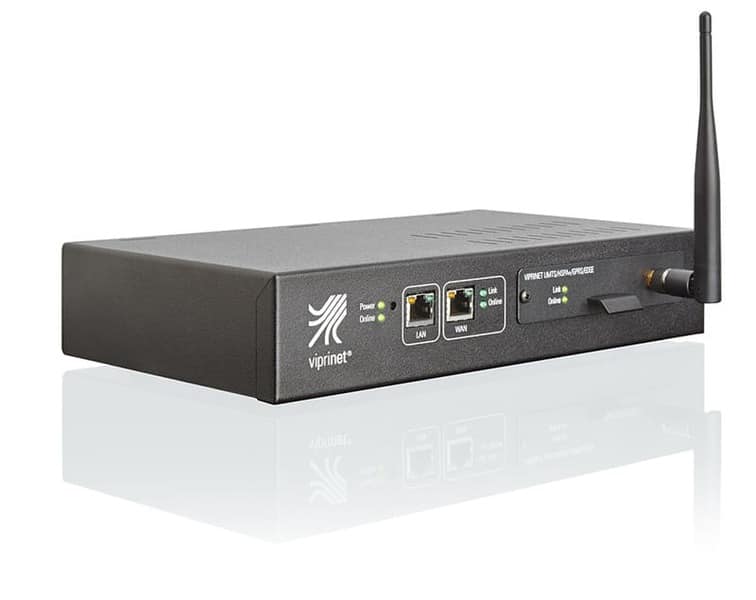 The picture shows the Ascend Viprinet Multichannel VPN Router 200. The router is a technical device with many connections and antennas. It has a rectangular housing with rounded corners and is mostly transparent so that you can see the various components inside. The router stands on a white background and the cable connections are clearly visible
